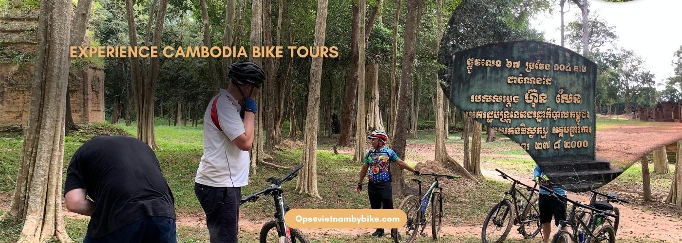 Cyclists enjoying a Cambodia bike tour through rural landscapes